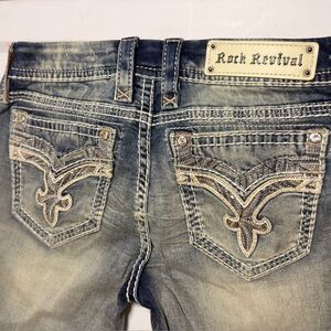 Rock Revival Faded Blue Jeans with Embellished Pockets